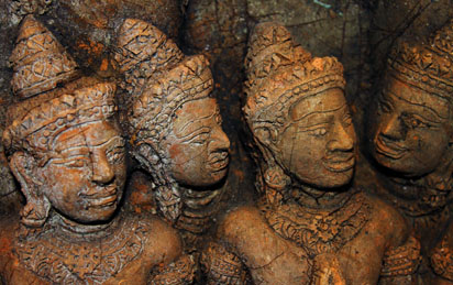 Close up of statue with faces