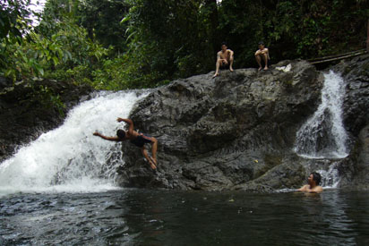 Someone backflipping into waterfall