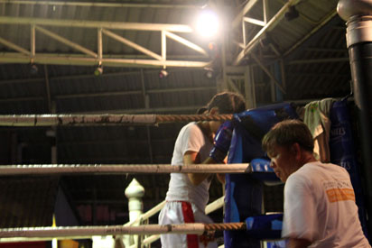 Female Muay Thai boxer prepares for battle