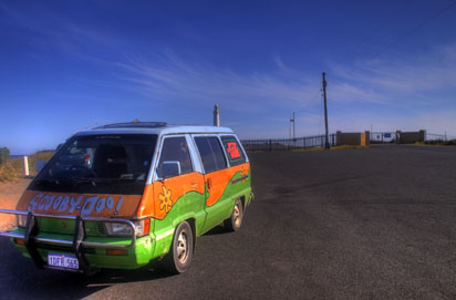 Mystery Machine beside lighthouse